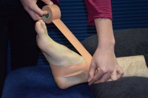 Patient Receiving Ankle Strapping